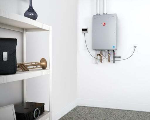Tankless water heater installed on wall in home.