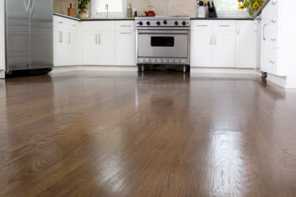 Hardwood floors in a custom kitchen, with the camera focusing on the floors.